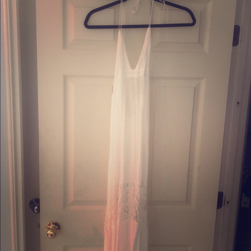Small white backless maxi dress with lace stripe.